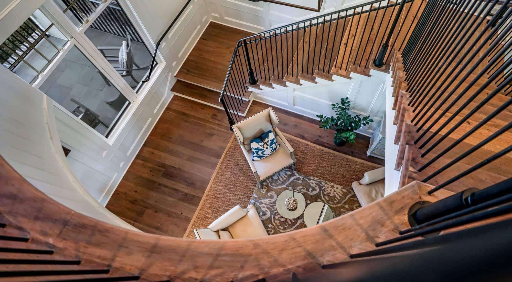 View of living room area from second story banister