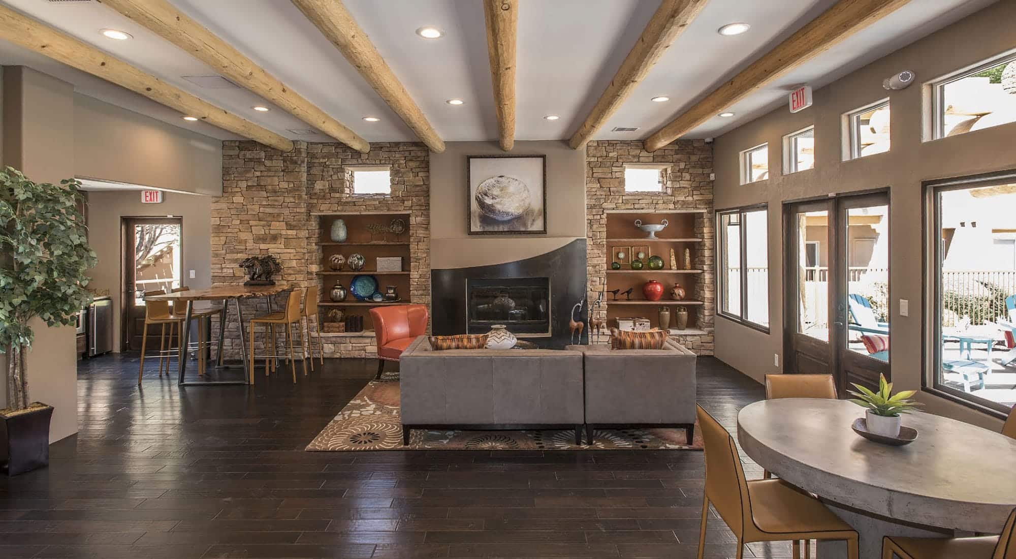 Rustic-themed lodge with multiple seating options facing the pool area